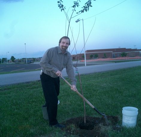 Thom Daniel planting Cherry Tree